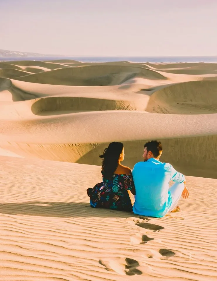 Couple watching the dunes at sunset